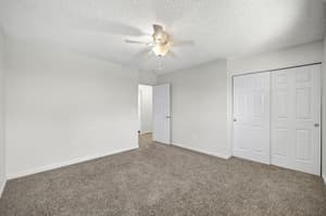 Bedroom with carpeted floor, ceiling fan at Lincoln Court Townhomes, 230 Lincoln Street, Fairview, Oregon 97024