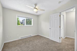 Bedroom with ceiling fan, carpeted floor at Lincoln Court Townhomes, 230 Lincoln Street, Fairview, Oregon 97024