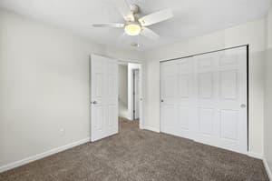 Bedroom with ceiling fan, carpeted floor at Lincoln Court Townhomes, 230 Lincoln Street, Fairview, Oregon 97024