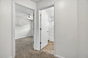 Hallway with carpet flooring, ceiling fan at Lincoln Court Townhomes, 230 Lincoln Street, Fairview, Oregon 97024