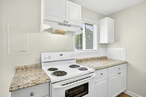 Kitchen with white cabinets, laminate countertops at Lincoln Court Townhomes, 230 Lincoln Street, Fairview, Oregon 97024