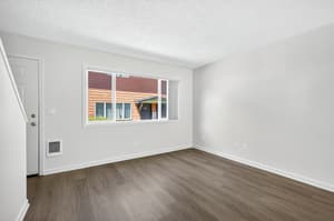 Living Room with large window, hardwood floors at Lincoln Court Townhomes, 230 Lincoln Street, Fairview, Oregon 97024