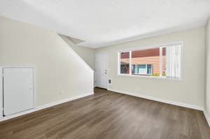 Living Room with large window, wood floors at Lincoln Court Townhomes, 230 Lincoln Street, Fairview, Oregon 97024
