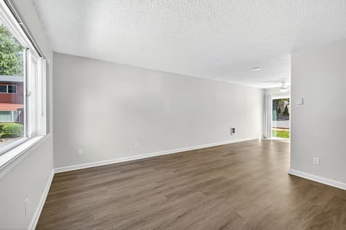 2 Bedroom townhome living room with large windows at Lincoln Court Townhomes