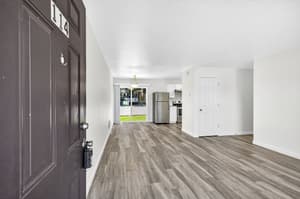 Living Room with laminate floors, sliding glass doors at Lincoln Court Townhomes, 230 Lincoln Street, Fairview, Oregon 97024