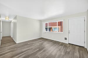 Living Room with large window, wood flooring at Lincoln Court Townhomes, 230 Lincoln Street, Fairview, Oregon 97024
