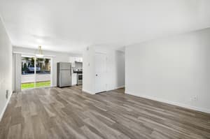 Living Room with stainless steel appliances, sliding glass door at Lincoln Court Townhomes, 230 Lincoln Street, Fairview, Oregon 97024