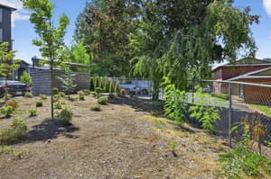 Exterior with chain link fence, landscaped garden at Lincoln Court Townhomes, 230 Lincoln Street, Fairview, Oregon 97024