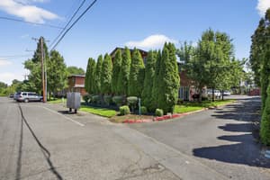 Exterior with landscaped garden, paved road at Lincoln Court Townhomes, 230 Lincoln Street, Fairview, Oregon 97024