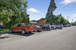 Exterior with parking lot, trees at Lincoln Court Townhomes, 230 Lincoln Street, Fairview, Oregon 97024