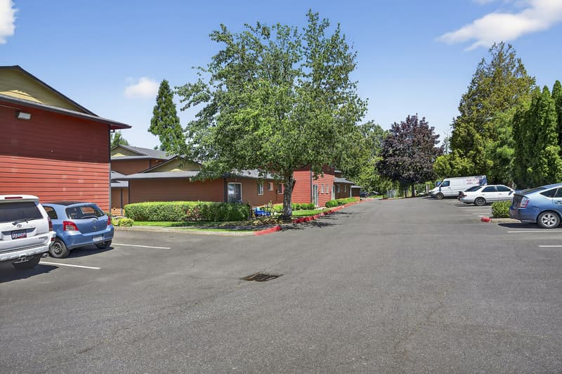 Exterior with parking lot, landscaped trees at Lincoln Court Townhomes, 230 Lincoln Street, Fairview, Oregon 97024